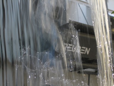 One of the fountains in Khartoum Place gives a different view of a city cafe.