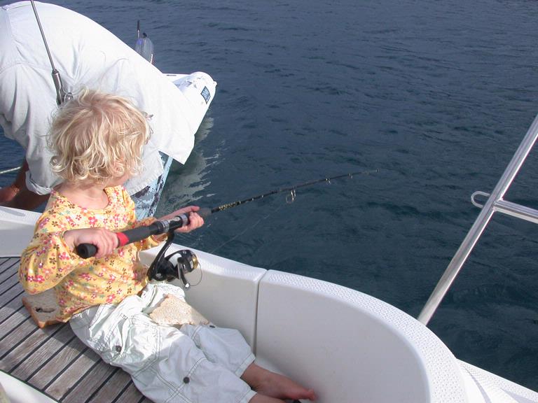 Victor Tourok;Young girl is like fishing; She is fishing near Waiheke Island