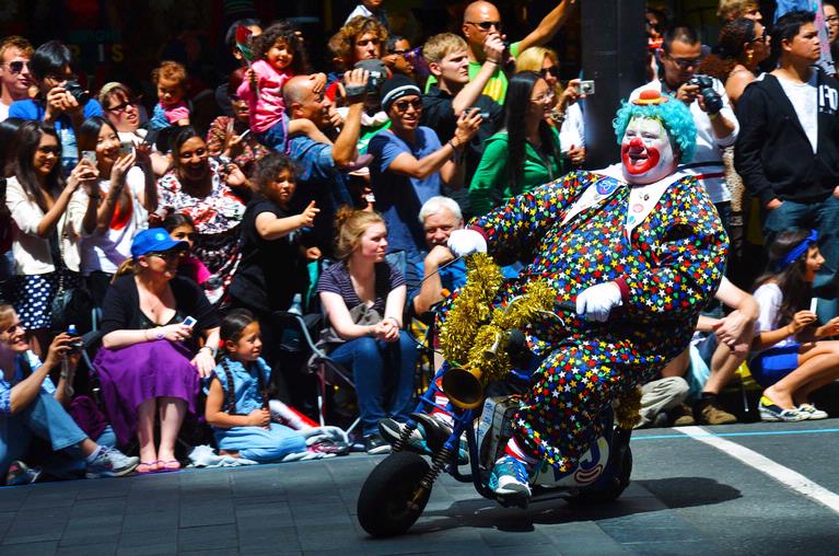 Ramon Richard V. Francisco; clown ride;a clown rides a tiny bike for auckland's annual santa parade
