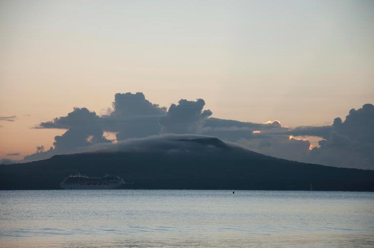 Aaron Salazar; Camouflage; This ferry passing along Hauraki Gulf seems in camouflage with the shadowy Rangitoto Island on a fine summer morning. Photo taken at Milford Park, North Shore.
