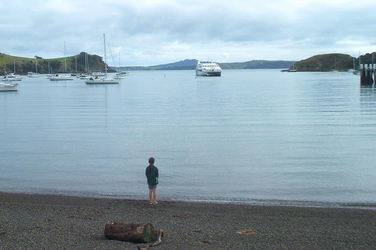 Jane Scorey; Girl waiting for ferry; Fullers ferry arriving at Matiatia Wharf, Waiheke Island