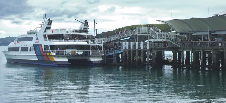 Jane Scorey; People disembarking Fullers ferry at Matiatia Wharf, Waiheke Island; Weekend tourists to Waiheke Island
