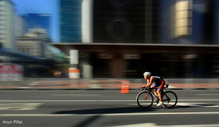 Arun Sarasakshan Pillai; Racing along; Panning shot of a cyclist from Ironman, Auckland