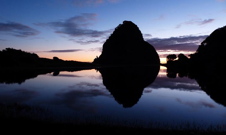 I took this photo of Lion Rock reflected in Piha Stream at dusk on a very still day in mid winter.