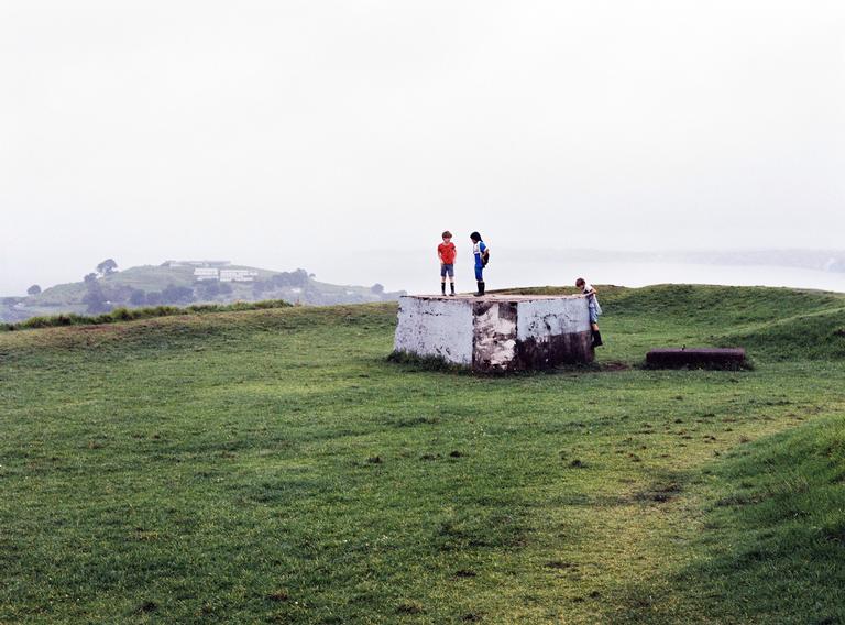 Michael Krzanich;Kings (2018).;View from Takarunga (previously Mt Victoria) of boys playing on the bunker on a rainy day. Shot with medium format film.