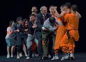 John Ling; Shaolin Kungfu in Auckland Chinese New Year Festival 2008; A group of about 30 young Shaolin Monks from China visit Auckland during the Chinese new festival. They perform Shaolin Kungfu in Skycity, Aotea centre and the Lantern festival. The photo was taken when a Shaolin monk use the belly (feat of strength) holding a rice bowl. But seven audiences cannot pull it out!