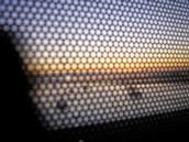 Jenny Jeffries; Through a window darkly; Taken through the back of advertising on a GoWest to the city on GoWest