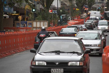 Dennis Chuah; The Queen City; Orange baricades line road works on Queen Street