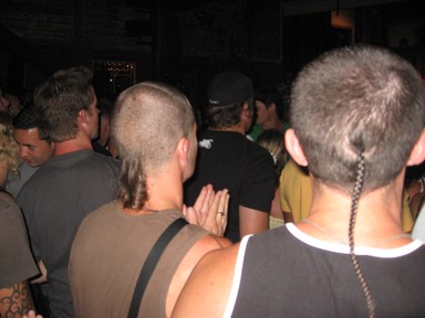 Ewan Hall; twins; 2 friends holding onto their wetstieness at a gig at the leigh sawmill