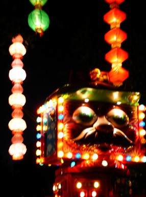 Tabitha Yap;Dreaming in Colour...and Light.;1 of 33 pictures taken at this year's Lantern Festival. One attraction that caught my eye at the festival was this Robot Man funfair ride. His bright and blinking neon lights, together with the lanterns' delicate radiance made the atmosphere seem suddenly surreal and dreamlike...