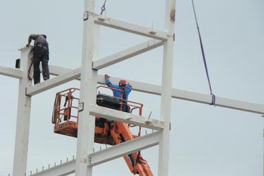 Dylan Bjoux;Men At Work; A picture taken on Reimers Ave of the men working at Eden Park.