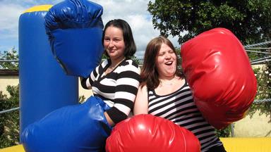 Lindsey Watson; Round one; 2 work mates on a blow up boxing ring