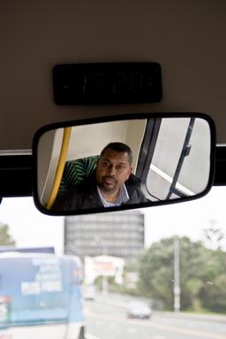 Israel Dickson; Safety First; Friendly bus driver checks the rear door for passangers. From CBD to Mt Eden.  taken 3.20pm 26/05/09