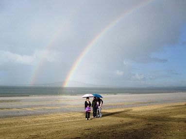 JERRY ZINN; CHATTING ON TAKAPUNA BEACH; TAKEN ON TAKAPUNA BEACH AFTER A HEAVY DOWNPOUR