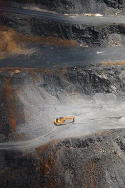 Chris Melville; Bigger Digger;A digger is dwarfed by the quarry it dug, South Auckland. 2009