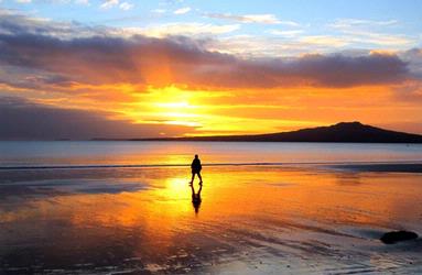 JERRY ZINN; EARLY WALKER ON TAKAPUNA BEACH; This was a magnificent sunrise on Takapuna beach