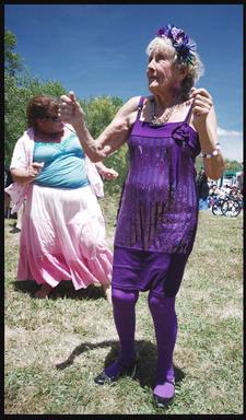 Phil and Yvonne Morton;young at heart; This Elvis fan was given the purple outfit by her family for her 90th birthday. She is dancing at Elvis in the Park in Henderson this month