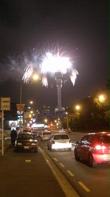 Julia D; Finale New Years Eve 09; Big Bang   cars parked, people look up from Fanshawe St