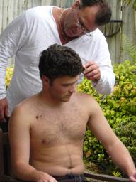  Robert cutting sam's hair.