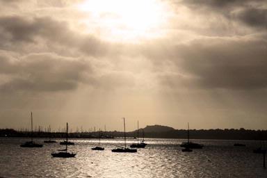 Jade Lim; Let There Be Light; As I was heading to the city from the Auckland Harbour Bridge, I saw the light shining down. A brand new day started with a ray of hope, courage and happiness. This made my day.