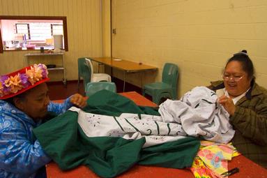  These women, who are a part of a larger group of women,  are captured in the art of making a Cook Island quilt, known as a Tivaevae.  The Tivaevae is a huge part of the Cook Island culture.