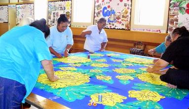 Alwynne Wedgwood; Tacking the Tivaevae; Every Monday  morning a group of St Andrews Otahuhu members meet to learn traditional crafts. Here we are tacking the templates on to a Tivaevae