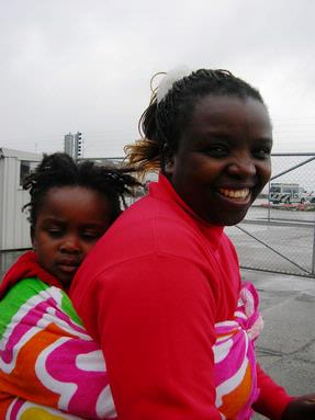 Judy Klaus;In transit; Sleeping child on mum's back