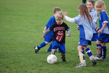 Chris Brittenden; Battle of the Sexes; This little guy is filling in for the opposition against his sisters all girl team.  More than slightly determined to win!