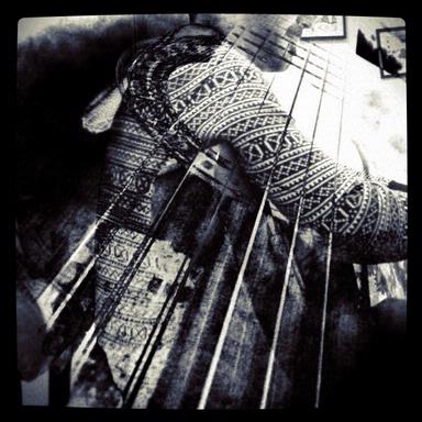 idil; This is a double exposure showing my partner playing the guitar and becoming one with the guitar : ) Taken at Auckland, Parnell.
