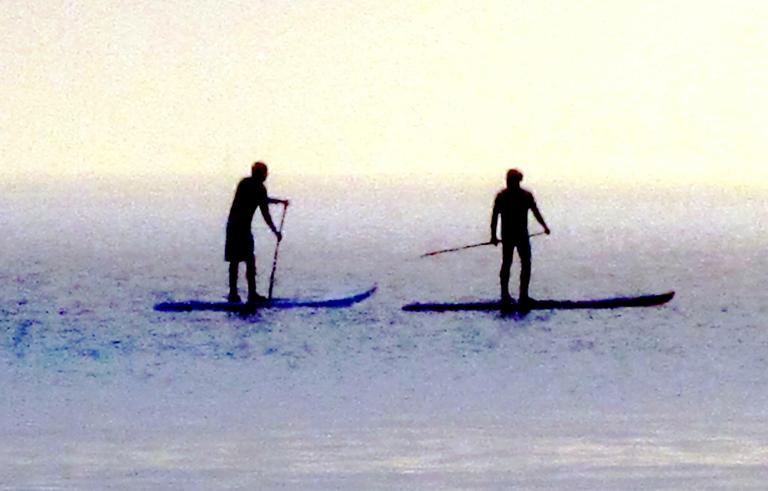 JERRY ZINN.;PADDLE BOARDING.