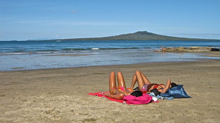 JERRY ZINN; RELAXING ON TAKAPUNA BEACH.