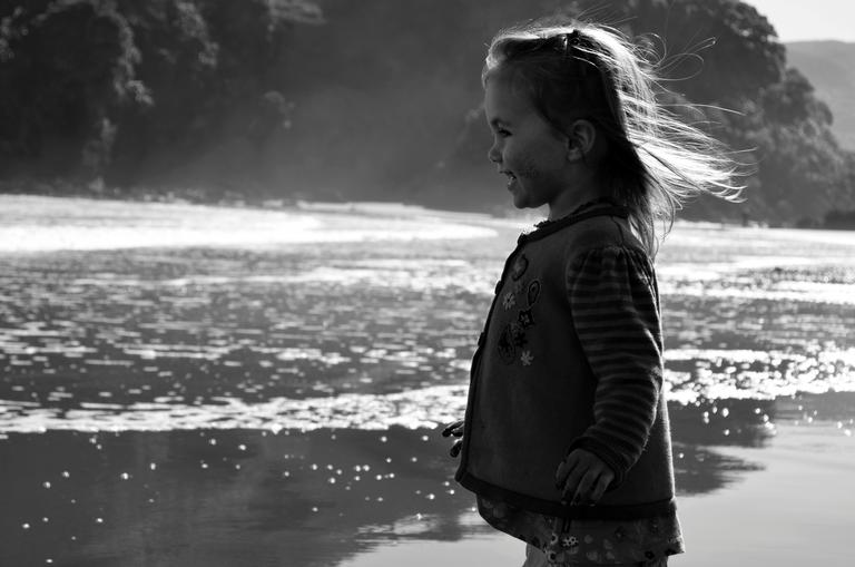 Jago Neal; Frida at Piha; My daughter loves Piha. The expression on her face says it all as she watches the ocean
