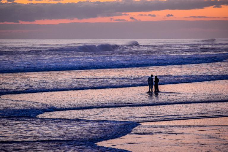 Jeremy Chi; Muriwai and a Couple; The sea and the beach belonged to them.