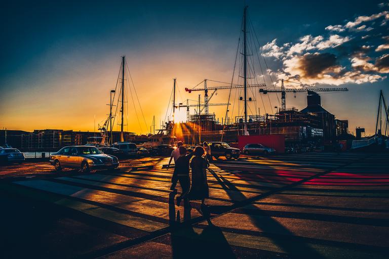 Jeremy Chi; Sunset at the Wharf; A snapshot of people walking against the light from the setting sun.