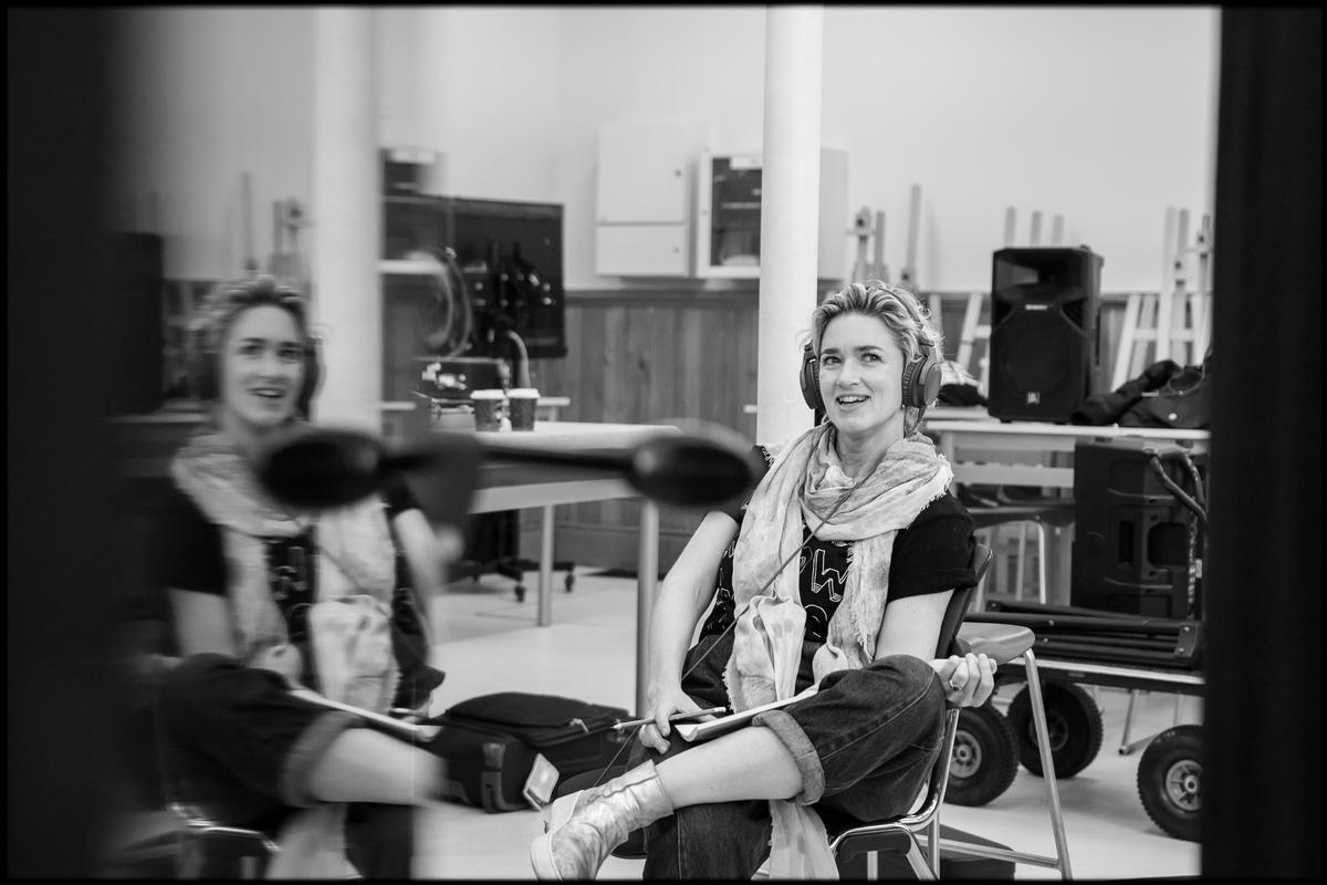 Amanda Ratcliffe;Julia Deans at the Arts Centre   Christchurch, 2021;Julia Deans at the Christchurch Arts Centre during a recording session at SongHubs Ōtautahi 2021. This image was made with the use of a reflection on the side of a piano in the space. No filter has been used to create this piece.