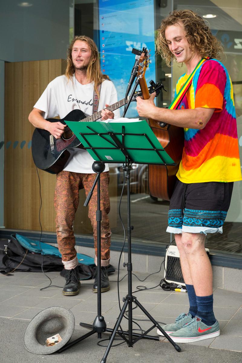 Gebhard Krewitt; #0446	Elijah Paul Webby, 23, New Plymouth, NZL, qualified bricklayer   Bodean Davis, 20, New Plymouth, NZL, Busker;song4you: There is nothing nicer in Nelson than going to the market on a Saturday morning, meeting people, drinking a coffee and just inhaling the atmosphere. A part of this atmosphere is purely acoustic in nature and is created by the many street musicians and buskers, which you can see and hear on your way from the parking area to the sausage stall in the center of the market. One half of these musicians performing at the Saturday market are locals, the other half comes from many other places including overseas, to Nelson to a very grateful audience. In recent years, Gebhard Krewitt has photographed many of these musicians in his very own documentary way, in order to highlight the particularity of each individual musician.