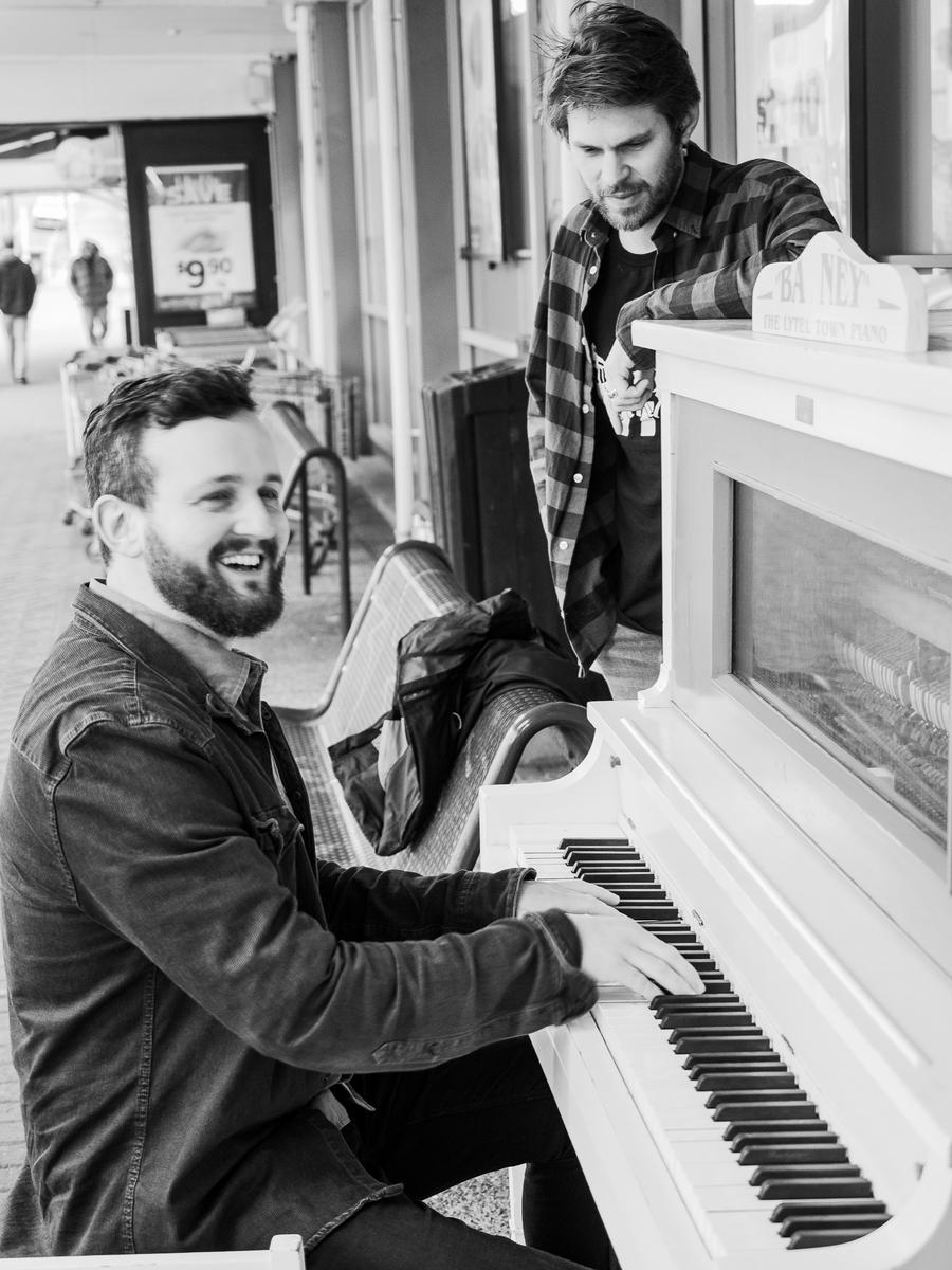 Patrick Rose; Bad Llamas in London Street; When I was consulting to my friends about this competition, they suggest I use my photoshoot photos, but a photoshoot with a group of people without instruments would not make the cut. While browsing through my Album “The Best of 2020”, I saw this picture of Jimi & Sammy in London Street in Lyttelton. Jimi & Sammy are in a band called Bad Llamas, and they requested me to do a photoshoot for their adverts, and they decided to play on the piano that rests outside the local Supervalue.