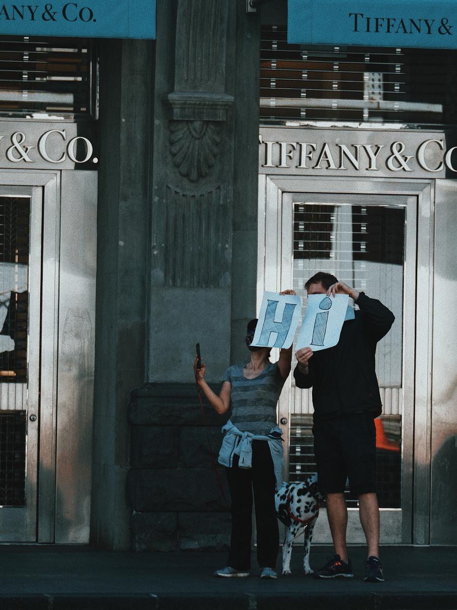 Beverly;Hello from the other side!;Noticed this couple holding this sign to their friend/family in the MIQ