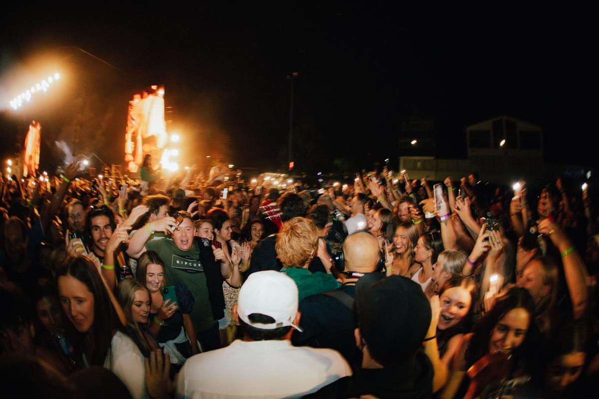 Jared Tinetti; six60 walking through the crowd to stage