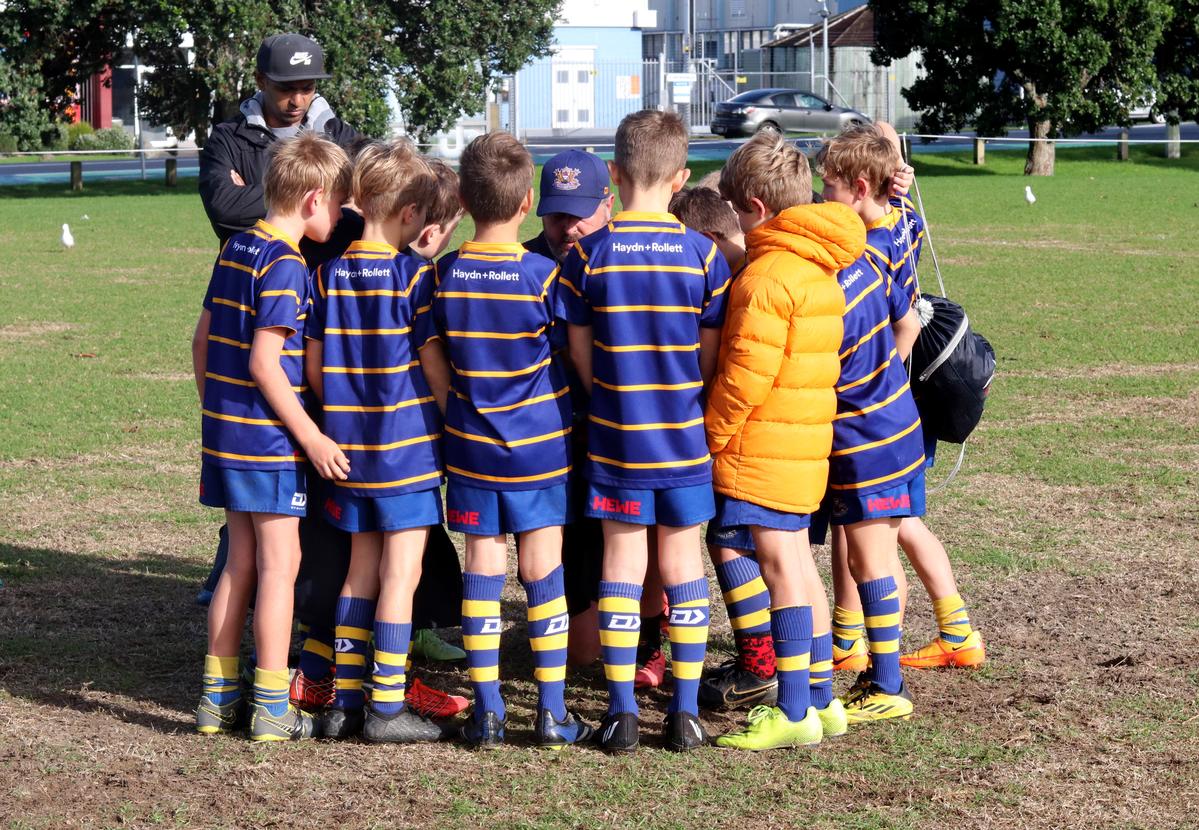 Tina Frantzen;Team talk with the coach getting right down on their level.