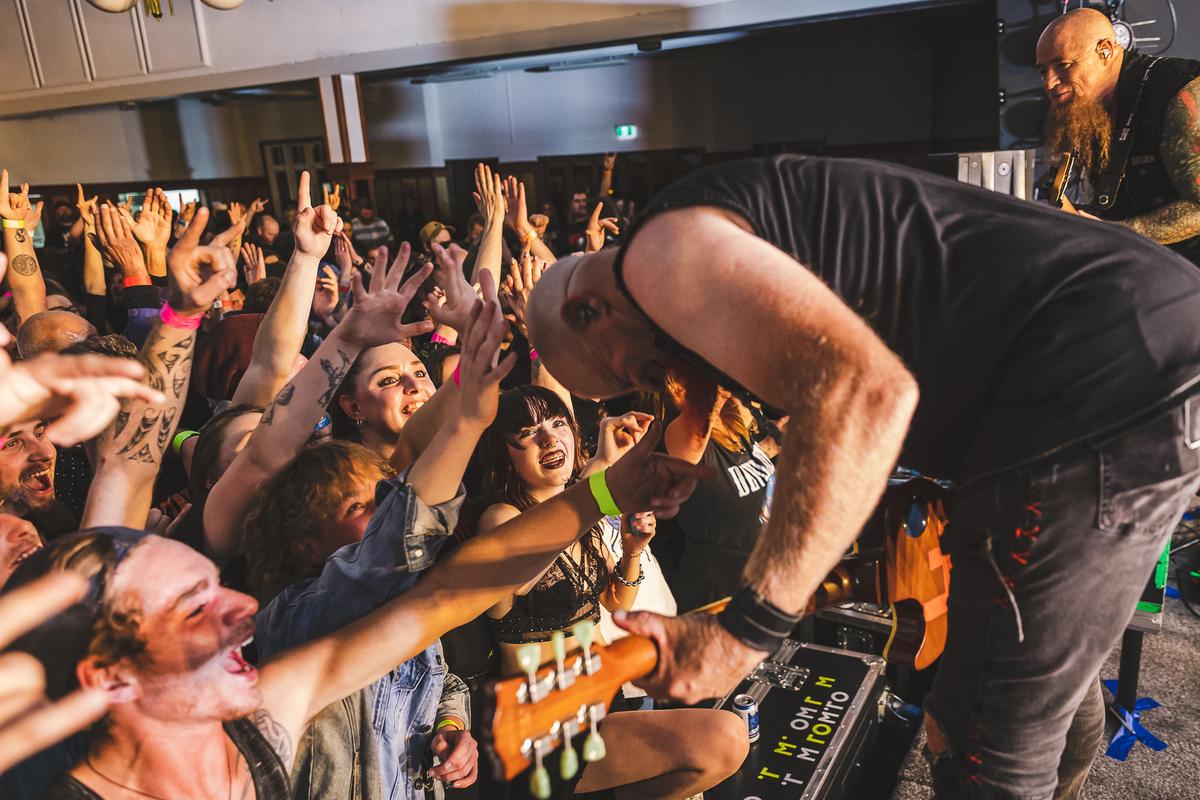 Bevan Triebels;Nail Devilskin;Nail getting a pat on the head from the crowd in Timaru