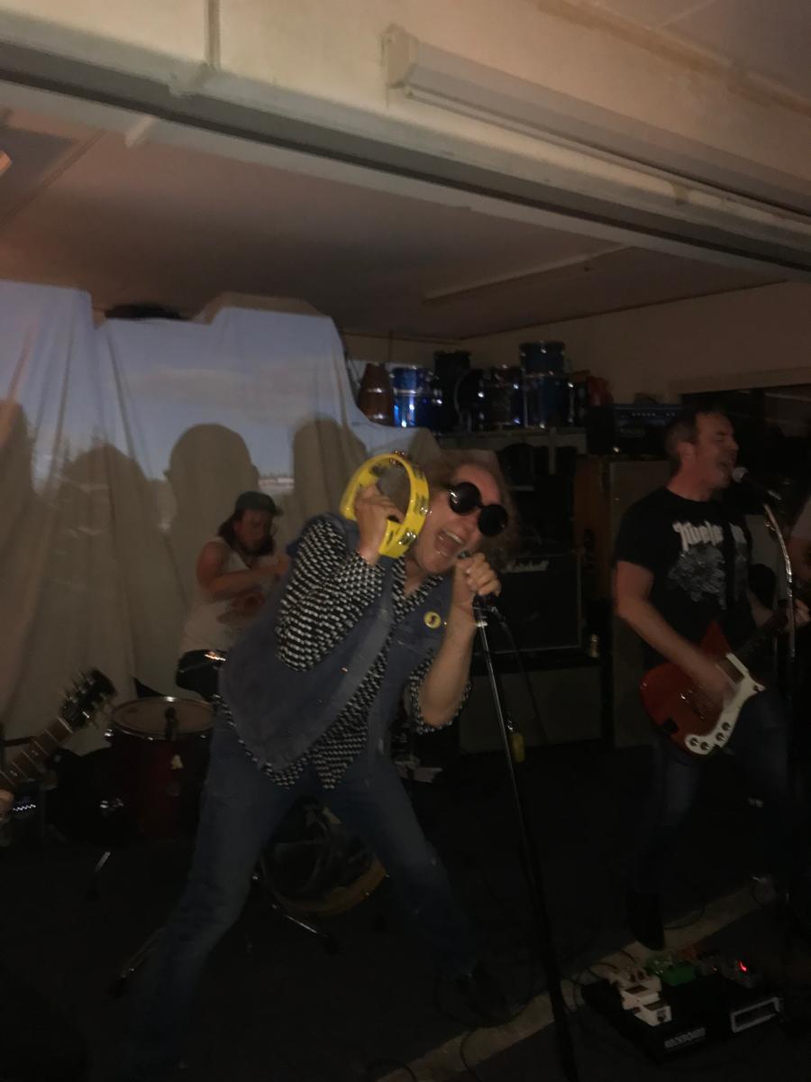 Isabella Fernie: DEAD MOON   John lead singer   centre subject, slow shutter speed, shadowing,