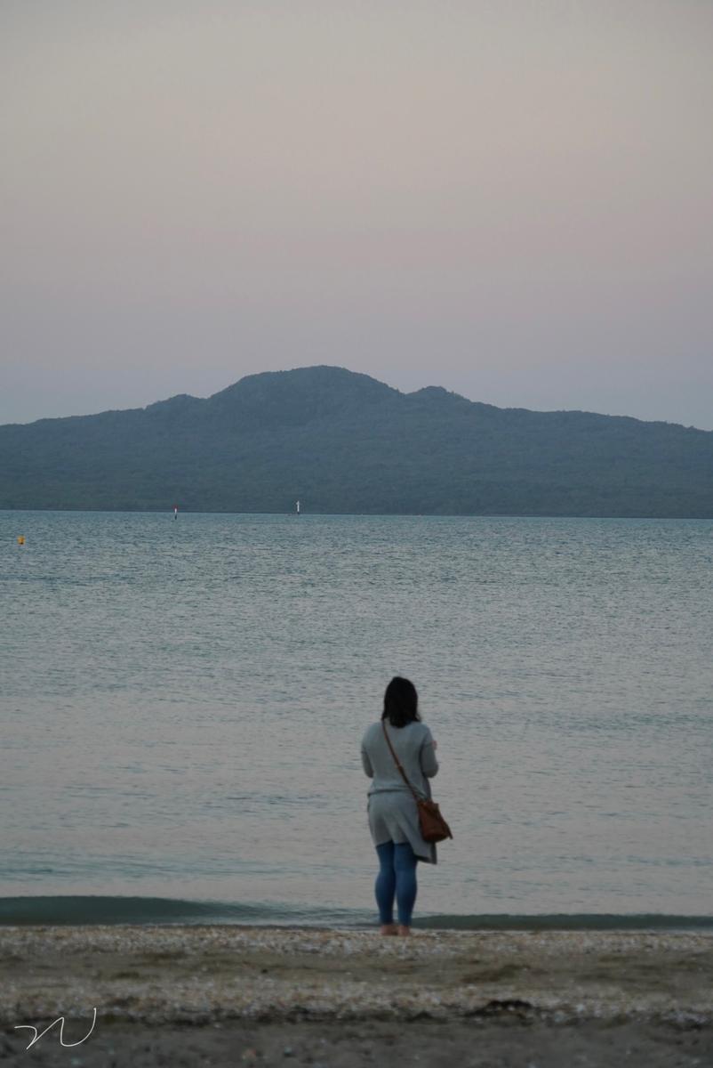 Chenguang Nie;Me ;During the sunset, I took a photo of a famle who are looking to the Rangitoto Island