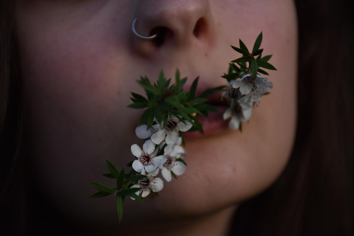 Gemma Monk;A taste for nature;Flowers shown bunched in a models mouth. Nature is essential for human survival. This image shows the significance of that.