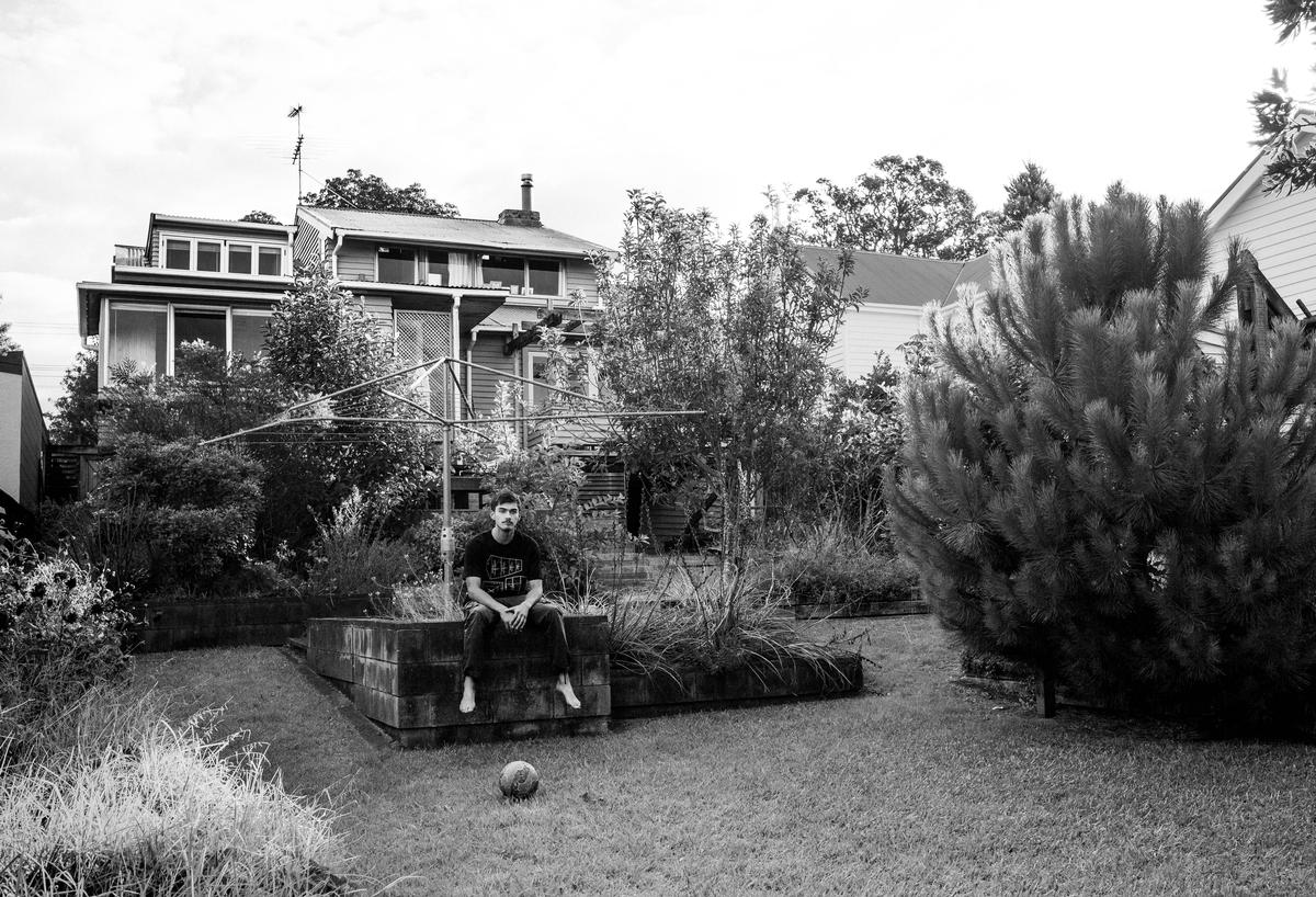 Johnny de Silva;'Jerome, 2023.'   'I can say, I love you.';Taken as part of my project, ‘I can say, I love you’. These works derived from a realisation that there was a detachment between the young men in my life and their ability to outwardly express their emotions. In an effort to oppose this I used the portrait as an opportunity to explore the intimacy it creates. Trying to instigate a conversation with them, combating the awkwardness emotional expression may bring. Giving space to communicate thoughts that more often than not stay internalized. These conversations in turn not only brought solace to them, but also to myself and my own need for an honest chat in a space free of judgement.
