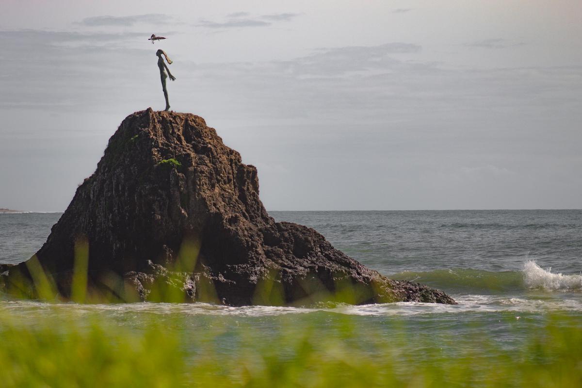 Reanna Hinds;Wairaka   The Lady on the Rock;Wairaka symbolises power and tenacity because she was a spirited young teenager  who saved the lives of others in her waka. Here I captured a cheeky bird landing on her head.