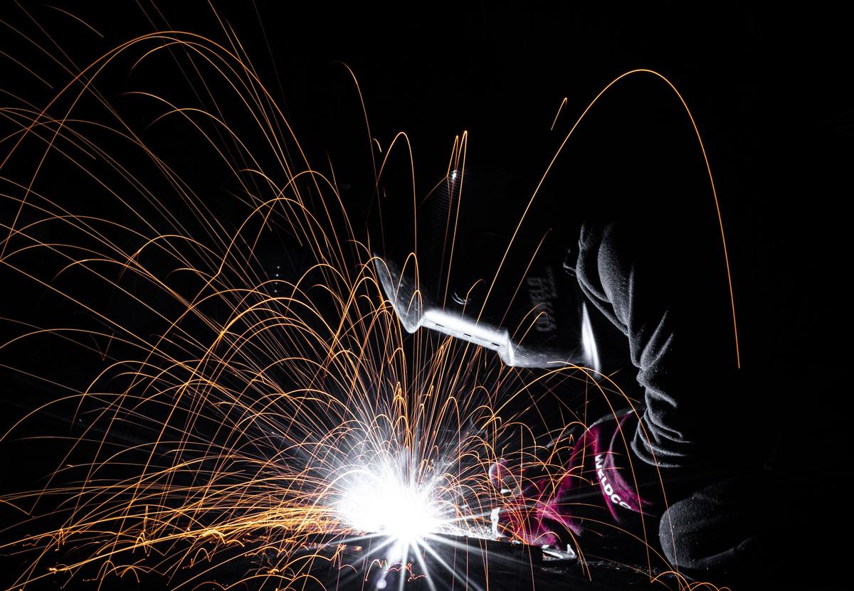 Sophie Hansen;Kiwi ingenuity ;My brother in the shed, wielding up old scrap metal to create something new.