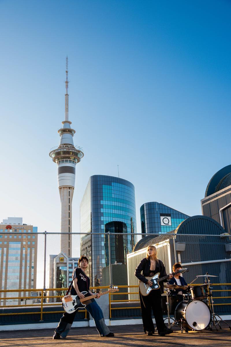 Chloe Tredgett; Coast Arcade by Chloe Tredgett;Coast Arcade playing in front of Auckland's Sky Tower