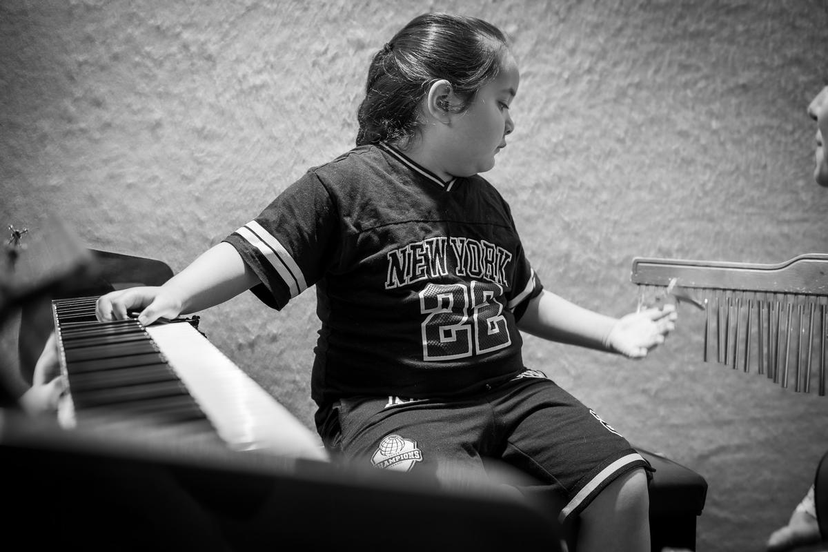 Francesca Brugnoli; Rhythm connects us to our deepest sense of safety. Dean during a music therapy session at the Raukatauri Music Therapy Centre in Auckland. Originally produced for E Tangata, this documentary photo essay explores connection and healing through music therapy.