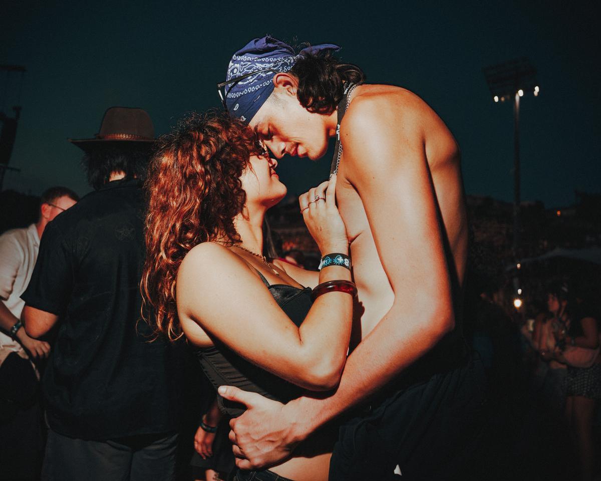 Tom Grut; Young couple share a moment; Laneway
